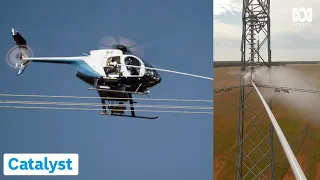 Washing Live Power Lines From A Helicopter | Extreme Jobs