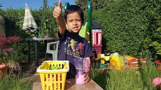 Little Boy Playing in Garden