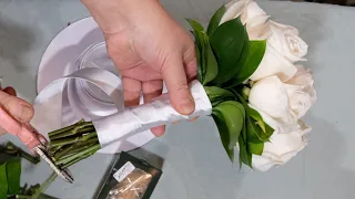 Arranging a perfect bridal bouquet with 12 roses