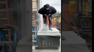 Drilling holes in stone slab for feather and wedge splitting process