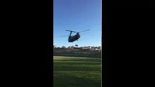 Royal Air Force Chinook hovering over a football pitch in Brighton