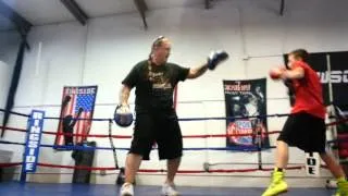 Coach Pete White and Tyler Cooper hitting mitts