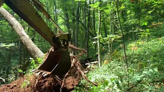 Building a Road with a Backhoe in the Mountains