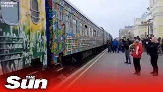 Crowds greet first train from Kyiv to arrive in Kherson since Russians fled