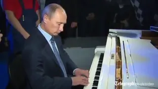 Vladimir Putin plays piano in sing a long at Moscow theatre360P