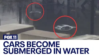 California storm: Cars become submerged in water in Long Beach