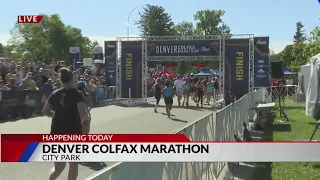 Runners cross the finish line at the Denver Colfax Marathon