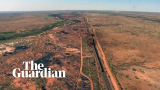 BHP train derailment: footage shows two-kilometre train crash in outback Australia