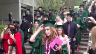 Zoe walking at graduation from Evergreen.