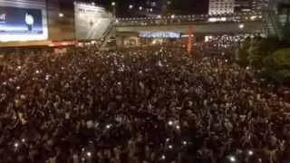 Hong Kong protesters sing and light up the streets on second day of protests