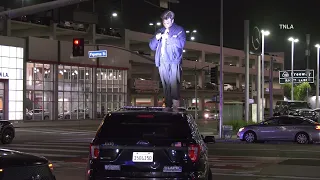 Man Climbs On Top of LAPD Cruiser - Downtown LA