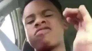 Tay K Tay K 47 Throwing Up gang signs. Crip signs in a red shirt?