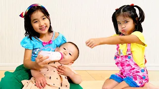 Twins want to take care of baby