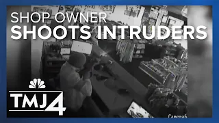 Shootout with would-be burglars and owner of luxury store caught on camera