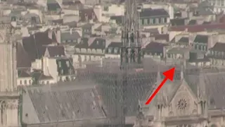 Notre Dame fire 2019-04-15 - Person moving and flash on the roof?