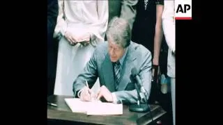 SYND 24 5 77 PRESIDENT CARTER SIGNS NEW TAX BILL