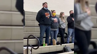 Dad sings impromptu National Anthem at high school basketball game after sound system fails