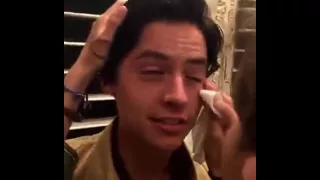 Cole getting makeup applied.