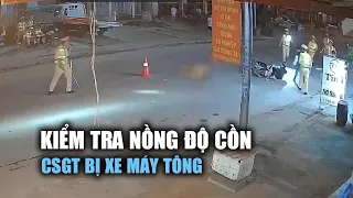 Cảnh sát giao thông bị xe máy tông khi kiểm tra nồng độ cồn