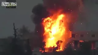 A SYRIAN REBEL BLOWS A REGIME TANK TO PIECES WITH A TOW ATGM ON THE ZUGHBA FRONT