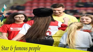 Katie Price and Chris Hughes kiss and make up as they reunite at football match