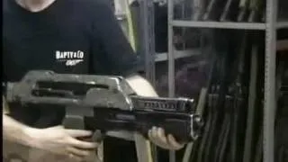 The Prop Store's Ian firing a Pulse Rifle from the sci-fi classic Aliens