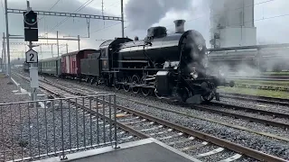 Swiss retro steam locomotive with passenger cars