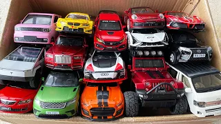 Box full of diecast Cars, Mini EV, Porsche, Ferrari, Jeep, Rolls Royce, Lamborghini, Tesla, RX350.