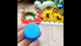 I made a crocheted keychain from plastic caps and beads 🤩