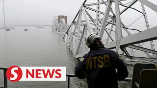 Salvage crews work to lift first piece of collapsed Baltimore bridge