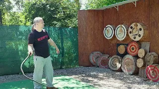 Pulling the throwing knife out of the target with a bullwhip