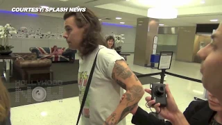 (VIDEO) One Direction's Harry Styles MOBBED By Fans At Airport