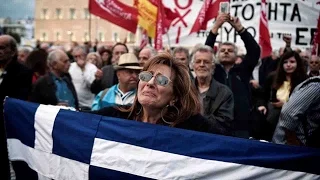 Greek parliament approves more austerity to unlock bailout funds