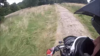 boring video of a supermoto in the woods