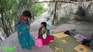 Sewing a nomadic dress by a mother for her daughter is the joy of nomadic life