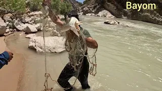 Fishing by nomadic man in the dangerous river
