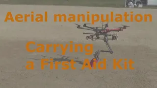 aerial manipulation, carrying a first aid kit, multicopter, drone, robot arm.