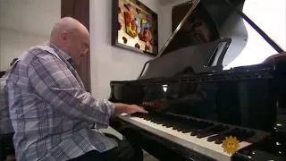 Phil Collins playing the Yamaha C3X Grand Piano at his home.