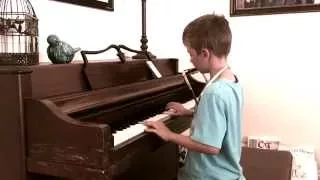 Talented 8 year old plays "The Piano Man"