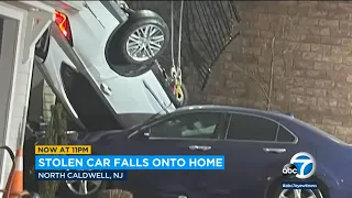 Video shows stolen car fall 20 feet and crash onto home