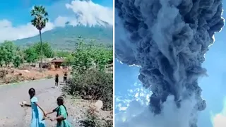 People seen fleeing as volcano erupts in Indonesia