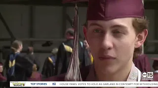 Months after losing his leg, Mountain Ridge High senior walks across the stage at his graduation