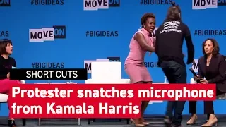 Watch this animal-rights protester snatch a microphone from Kamala Harris