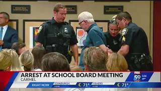 Man arrested at Carmel school board meeting after gun fell out of pocket