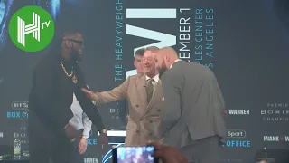 'My wife pushes harder than that!' | Tyson Fury and Deontay Wilder almost come to blows on stage