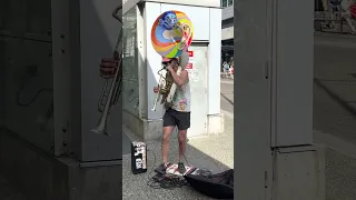 Busker playing the Tuba and beat boxing downtown Vancouver