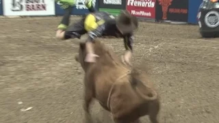 Bullfighter jumps over charging bull