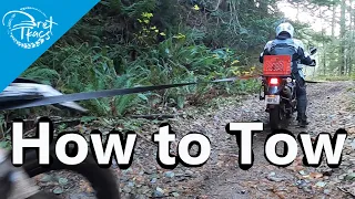 How to tow a motorcycle with a motorcycle on the trail