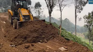 JCB Backhoe Leveling Mountain Road and Cutting Hillside