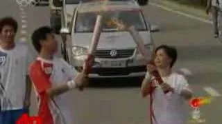 Raw Video: Runners Carry Olympic Torch